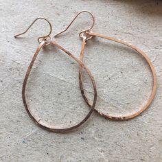 Everybody will notice these hoops on you because they reflect light in a really beautiful way. These hoops sparkle and are hand shaped, hammered, and polished to a glittering finish. The hammering gives the surface of the 14k rose gold filled wire a glittering effect. The entire earring is apprx 1 3/4". The hoop length alone is apprx 1.5". These are shown with Rose Gold Filled french ball earwires. PLEASE CHOOSE YOUR METAL and earwire choice. I can attach any stone or stones in my vast treasure Hammered Hoop Earrings, Colorful Jewelry, Hand Shapes, Gold Filled, Hoop Earrings, Sparkle, Rose Gold, Chain, Stone