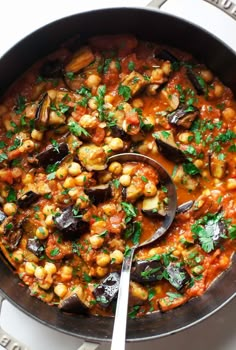 a pan filled with food and a spoon in it