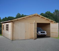 a car is parked in a wooden garage