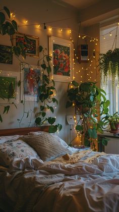 a bedroom with plants and lights on the wall