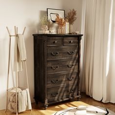 an old dresser is sitting in the corner of a room