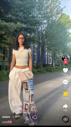 a woman standing in the middle of a street