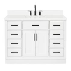 a white bathroom vanity with two sinks and black faucets