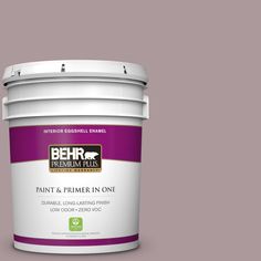 the behr paint and primer in one is shown on a gray background with red trim