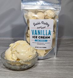 vanilla ice cream in a glass bowl next to a bag of vanilla flavored cookies