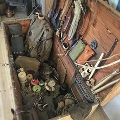 an old wooden box filled with lots of assorted items