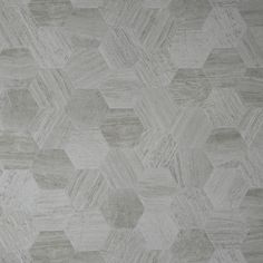 a white rug with hexagonal design on it