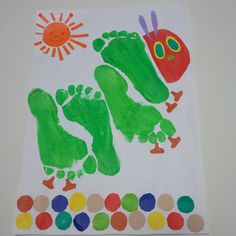 a child's hand and foot print made to look like the very hungry caterpillar