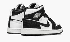 The Women’s Air Jordan 1 Mid “Split Black and White” is a women’s-exclusive colorway with a mismatched design.  As its name implies, the “Split Black and White” Jordan 1 Mid features a split appearance that inverses the shoe’s black-and-white color block on each side.  The lateral side of the shoe features a white tumbled leather base with contrasting black leather overlays and Swoosh branding.  The medial side reverses the color block, with a black leather base with white leather overlays and S Ying Yang Jordan 1, Womens Black And White Jordans, Jordan 1 Mid Split, Womens Air Jordan 1, Black And White Jordans, Womens Air Jordan, Jordan 1 Outfit Women, Latest Jordans, Jordan 1 Outfit