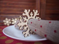 a white plate topped with a cake covered in icing and snowflakes