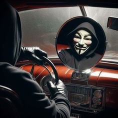 a person wearing a mask in front of a mirror with a car's dashboard