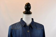 Everyone needs a denim button-up, and we love this one! It flatters a wide range of body types thanks to its dark wash and soft fabric. Chambray Button-down Material: Denim/Jean Front chest pockets Long sleeves can be rolled up Material: 100% cotton Color: Dark denim Fitted Button-up Denim Top For Everyday, Dark Wash Denim Top With Button Closure, Everyday Dark Wash Denim Top With Button Closure, Everyday Dark Wash Button-up Denim Top, Dark Wash Washed Denim Top For Work, Dark Wash Denim Button-up Top With Snap Buttons, Collared Dark Wash Denim Top With Button Closure, Dark Wash Collared Denim Top With Button Closure, Denim Jean