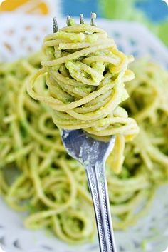 a close up of a fork with some food on it