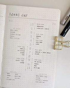 an open planner with the words ideal day written on it