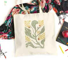 About our Boho Wildflower Tote Bag - Tote Bag with a unique floral design, perfect for any occasion. - 100% cotton canvas. Durable material that will last for years. - Heavy fabric (12 oz/yd² (406.9 g/m - Available in natural color. - Only one size: 15" x 16"- perfect for everyday wear, with 20" handles that ensure comfortable carrying. - Printed and shipped from the USA. Thank you for trusting us! Rectangular Canvas Bag With Floral Print, Floral Print Rectangular Canvas Bag, Rectangular Floral Print Canvas Bag, Botanical Cotton Canvas Bag For Daily Use, Botanical Cotton Canvas Bag For Everyday Use, Botanical Cotton Canvas Tote Bag, Everyday Cotton Canvas Bag With Floral Print, Floral Print Cotton Bag For Gift, Floral Print Cotton Bags For Gifts