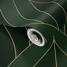 a green and gold wallpaper with an abstract design on it's side,