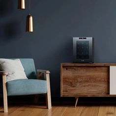 a living room with blue walls and wooden furniture on the floor next to a tv