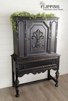 an old black cabinet with moss growing on it's top and the words flipping furniture and more above it