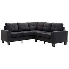 a black sectional couch sitting on top of a white floor