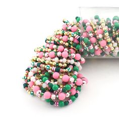 Indulge in some fruity fun with this Watermelon Stack! Drenched in juicy pink and green beads, this bracelet is the ultimate warm weather must-have. Add a playful and quirky touch to any ensemble with this charming accessory. Choose to purchase the full stack or an individual bracelet. 1 bracelet for $9 or 5 for $38 - Discount Applied at Checkout Lead & Nickel Free Bracelets are 'one size fits most' and are designed to fit wrists up to 7.5" comfortably. Please be aware that due to the unique and