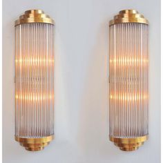 pair of wall lights in the form of ribbed glass and brass tubes, 1970s