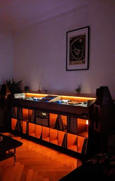 an entertainment center with lights in the corner and music equipment on it's sides