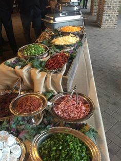 a buffet table with many different types of food on it