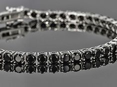 Black spinel 12.00ctw round, sterling silver tennis bracelet. Measures approximately 1/8"W. Black Spinel Jewelry, Black Spinel Bracelet, Custom Birthstone Ring, Black Diamond Bracelet, Diamond Party, Silver Tennis Bracelet, Diamond Tennis Bracelet, Man Made Diamonds, Wedding Jewelry Bracelets