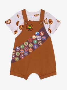 Little ones turn into wilderness explorers with this Up overall set! A badge-covered tee pairs perfectly with brown overalls  embroidered with the iconic Wilderness Explorer patch. The printed sash is filled with troop badges  including the Ellie Badge  aka the grape soda cap that Carl gives Russell! With adjustable straps and two buttons  it keeps any kiddo comfortable.A BoxLunch Exclusive!CottonListed in infant sizesWash cold with like colors; lay flat to dryImported Cute Baby Things, Overalls Embroidered, Fairytale Baby Shower, Brown Overalls, Wilderness Explorer, Kids Goals, Disney Baby Clothes, Baby Pop, Disney Bracelet