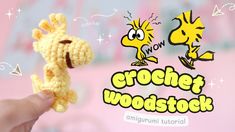 a crochet giraffe is shown in front of a pink background with the word wow on it