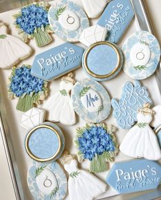 decorated cookies in the shape of bride and groom's rings on a cookie sheet