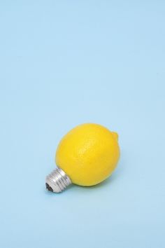 a lemon with a light bulb attached to it