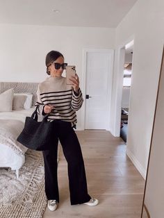 This entire outfit is 25% off right now at Bloomingdale's! These wide legged black jeans pair well with this matching black Onyx Naghedi tote bag (size medium) and striped sweater. You can check out the details on my LTK page! | sale, shop, shopping, looks, outfit, clothes, style, wardrobe, inspiration, fashion Black Wide Leg Jeans Outfit, Wide Leg Black Pants Outfit, Black Wide Leg Pants Outfit, Wide Pants Outfit, Wide Leg Trousers Outfit, Wide Leg Black Jeans, Wide Leg Outfit, Black Wide Leg Jeans, Black Pants Outfit