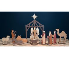 a nativity scene with figurines of the birth of jesus and three wise men