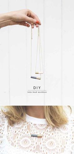 a woman's hand holding a necklace with the word diy on it