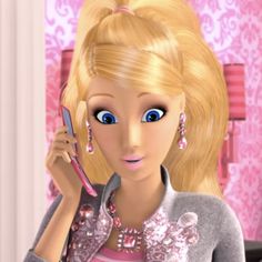 a barbie doll holding a cell phone to her ear