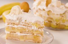 a piece of cake sitting on top of a glass plate next to some banana slices