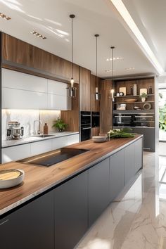 a modern kitchen with marble counter tops and wooden cabinets