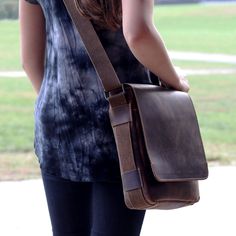 FREE GROUND SHIPPING & FREE MONOGRAMMING!BUFFALO LEATHER RUSTIC HUNTER FINISHThis casual, go-anywhere leather crossbody messenger bag is designed to fit today's active lifestyle. Handmade from buffalo leather with a hunter finish, it builds a rich patina and grows in character as it ages. The bag has vintage styling and camouflage lining with the right amount of space for your mobile devices, tablet, notepads, and charging cords. An open pocket under the flap and a zippered back compartment allo Casual Crossbody Bag, Small Messenger Bag, Charging Cord, Buffalo Leather, Crossbody Messenger Bag, E Reader, Crazy Horse, Leather Crossbody Bag, Leather Handmade