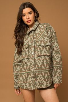 A unique and trendy addition to your outerwear collection. This shacket features an eye-catching Aztec print that adds a touch of bohemian flair to your look. The 3D front pockets provide both style and functionality, while the button closure adds a classic touch.Model SpecsHeight: 5'10"Bust: 33"Waist: 23.5"Hips: 35" Style: Casual Print / Pattern: Aztec Silhouette: Shacket Fit: Relaxed Embellishment: 3D Pockets Neck Line: Collar Sleeve: Long sleeve Length: Up to 35" Closure: Button Lining: No Ma Aztec Silhouette, Red Wine Dress, 3d Pocket, Aztec Shirt, Wine Red Dress, Wine Dress, Bold Dresses, Christmas Party Dress, Aztec Pattern