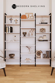 the modern shelving is organized with white shelves and black trimmings, along with two chairs