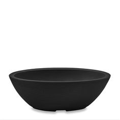 a black bowl sitting on top of a white table