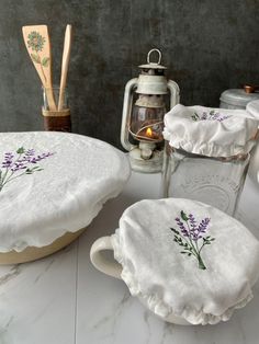 some white dishes with purple flowers on them