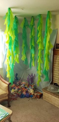 the room is decorated with green and yellow streamers