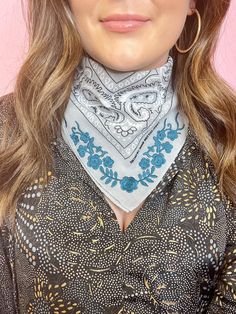 a close up of a woman wearing a bandana