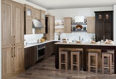 a large kitchen with wooden cabinets and counter tops, an island in the middle is surrounded by stools