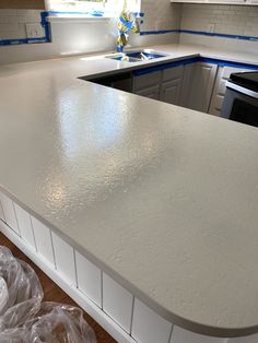 a white counter top in a kitchen under construction