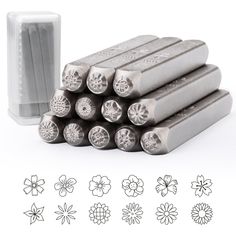 six different types of metal stamping tools with flowers and petals on the back side