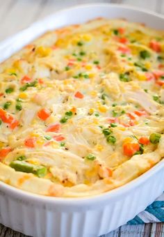 a casserole dish filled with chicken and vegetables