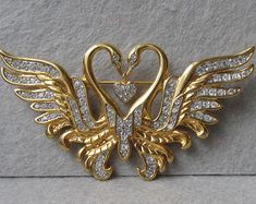 Signed Nolan Miller Two Swans with Dangling Heart Rhinestone Vintage Pin Brooch Two Swans, Swan Jewelry, Black And Gold Aesthetic, Bridal Jewellery Inspiration, Nolan Miller, Black Beads Mangalsutra, Heart Rhinestone, Jewellery Sketches, Gold Aesthetic